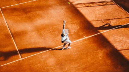 Tennisplayer is serving the ball